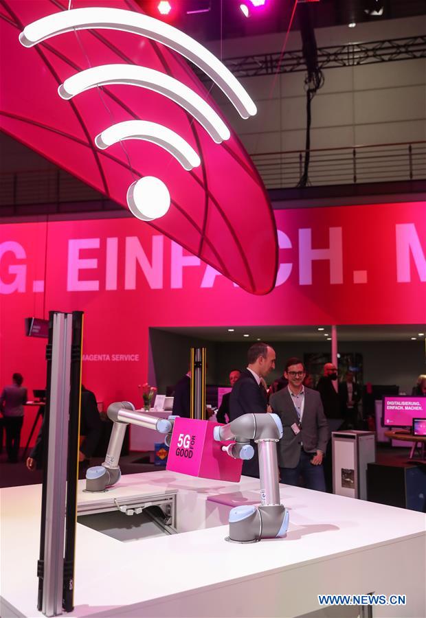 Photo taken on March 20, 2017 shows a view of '5G' mobile Internet Deutsche Telekom booth during the CeBIT 2017 in Hanover, Germany. The world's leading trade fair showcasing IT and communications products and solutions CeBIT 2017 kicked off on Monday and will last until March 24. The show with the theme 'd!conomy - no limits' this year attracted around 3,000 exhibitors from 70 countries and regions and is expected to attract some 200,000 visitors. (Xinhua/Shan Yuqi) 