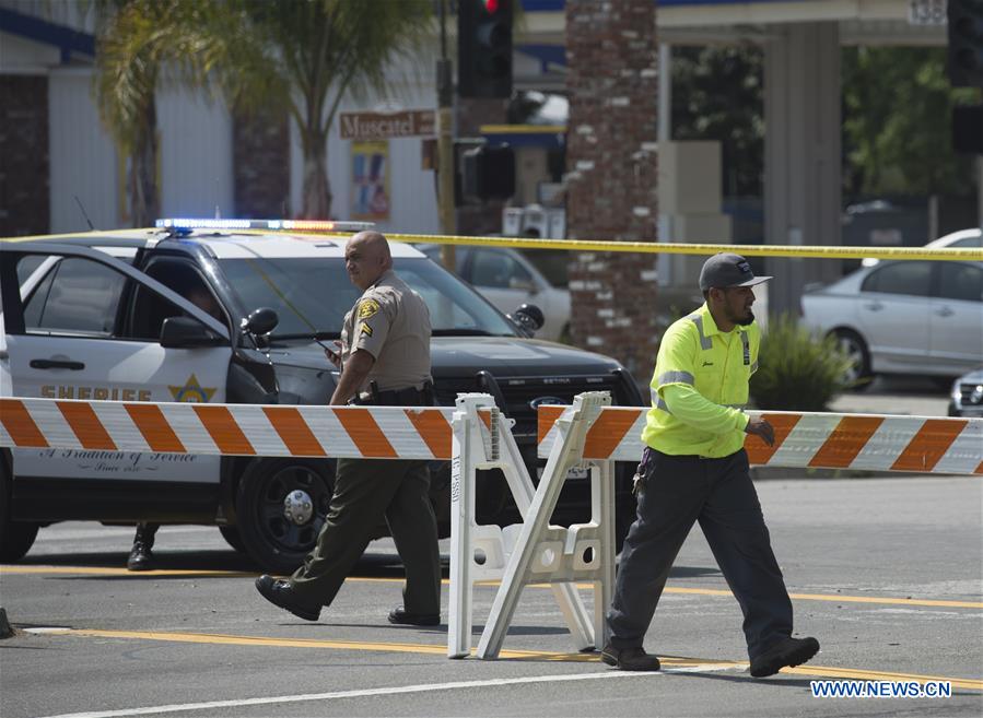 Police block the road near the site of a shootout outside a Los Angeles County sheriff's station, the United States, on March 20, 2017. An armed man died in a shootout outside a Los Angeles County sheriff's station early Monday morning, according to local authorities. (Xinhua/Yang Lei) 