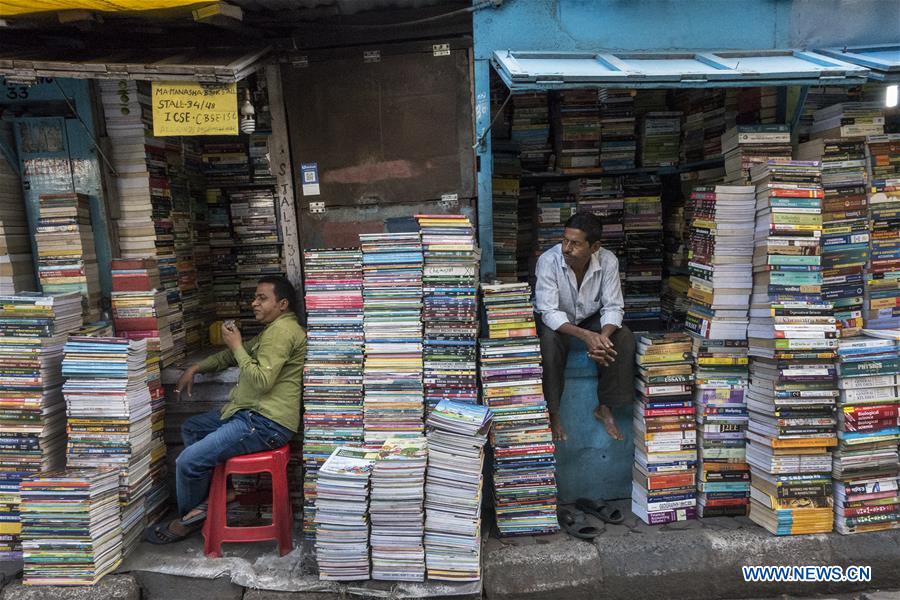 Indian bookshop owners wait for customers at a book market on College Street in Kolkata, capital of eastern Indian state West Bengal, on March 20, 2017. (Xinhua/Tumpa Mondal) 