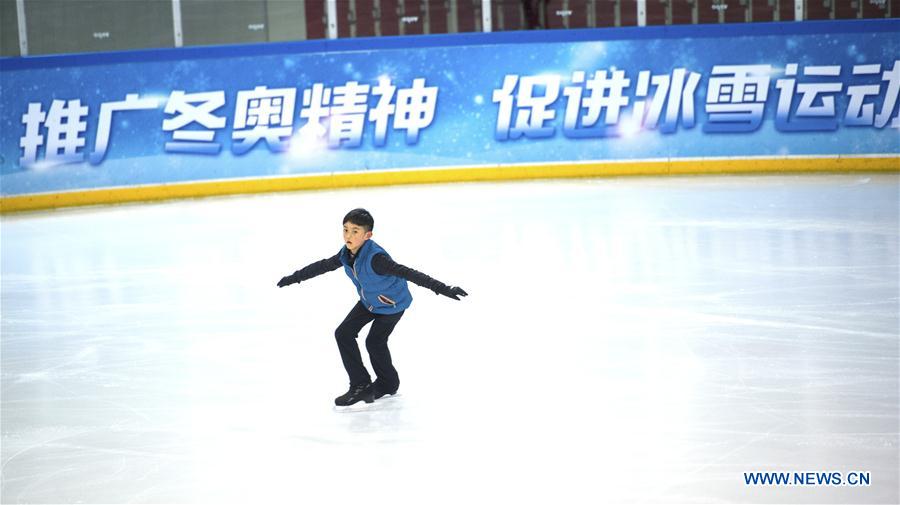 A boy practices figure skating in the ice rink located in Nanjing Olympic Center in Nanjing, capital of east China's Jiangsu province, March 7, 2017. With more and more people from south and west China participating in winter sports, the popularity of winter sports in east China's Jiangsu province began to grow fast. In recent years, 13 ice rinks using social capital have been opened in Jiangsu. The operators of these ice rinks established clubs to attract more than 100,000 people to practice skating. The Century Star Rink located in Nanjing Olympic Center is the biggest indoor ice rink in Nanjing. The club only had dozens of members in 2008, but now it has more than 20,000 members. At the mean time, the club cooperates with 8 elementary schools in neighborhood to open classes teaching skating skills. About 10,000 pupils learned the basic skills of skating and 4 ice hockey squads were founded in last 9 years. A total of 15 small outdoor ski resorts have also been set up in northern Jiangsu province. During the last snow season, which is only two months due to warm weather here, these ski resorts accommodated around 10,000 person-times of visitors. (Xinhua/Li Xiang)