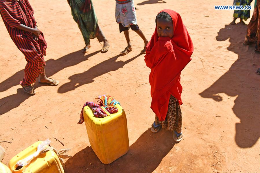 Photo taken on March 19, 2017 shows a little girl waiting to get water at an Internal Displaced Person (IDP) camp in Doolow, a border town with Ethiopia, Somalia. 
