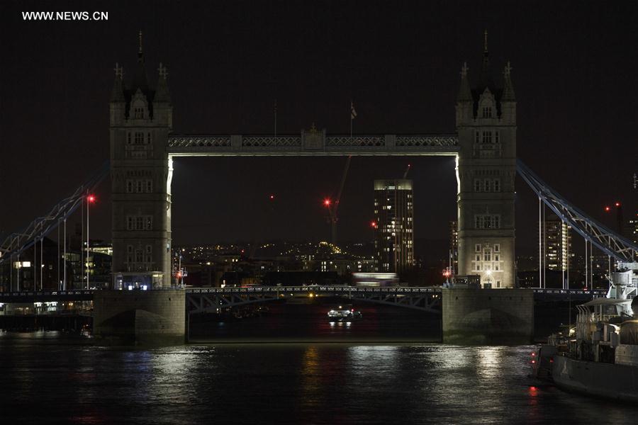 Tower Bridge is pictured with light off during the Earth Hour in London, Britain, on March 25, 2017.