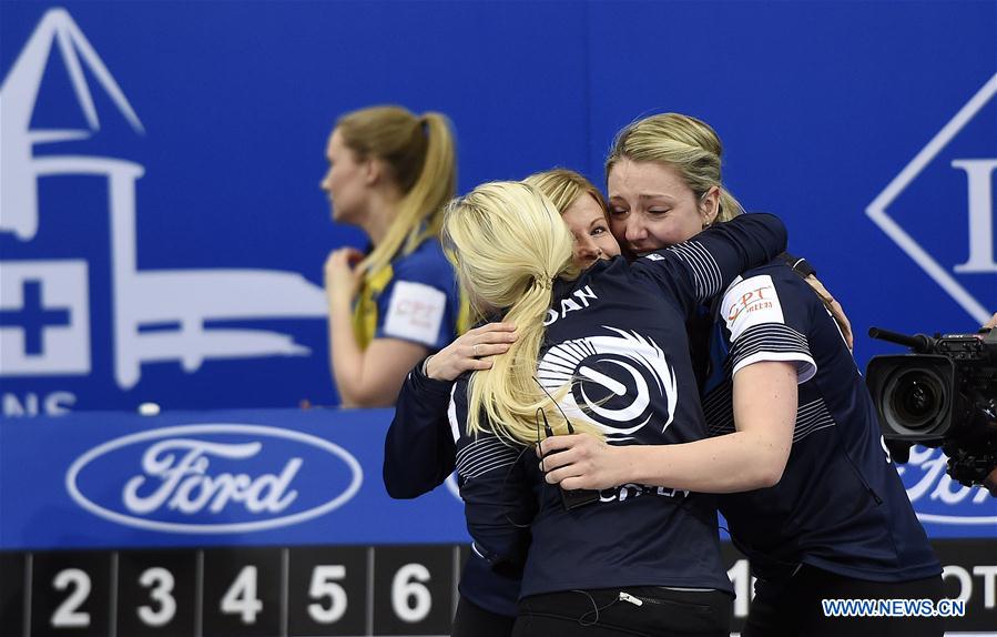 Players of Scotland celebrate victory after the bronze medal match against Sweden at the CPT World Women's Curling Championship 2017, in Beijing, capital of China, March 26, 2017. 