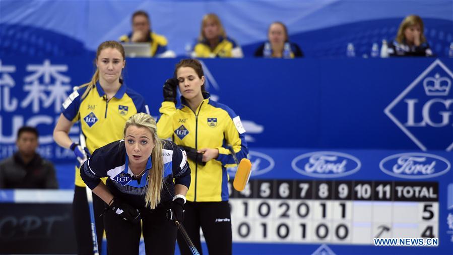 Anna Sloan (front) of Scotland competes during the bronze medal match against Sweden at the CPT World Women's Curling Championship 2017, in Beijing, capital of China, March 26, 2017. 