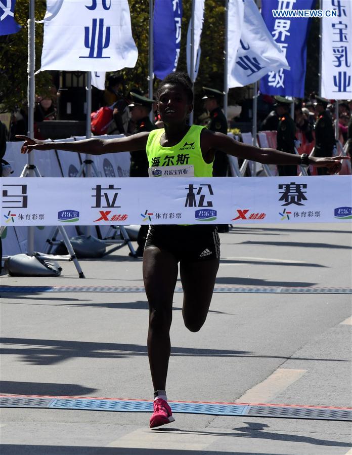 Gebeyahu Tigist Memuye from Ethiopia sprints to the finish line during the Zhengkai International Marathon in Kaifeng, city of central China's Henan Province on March 26, 2017. 