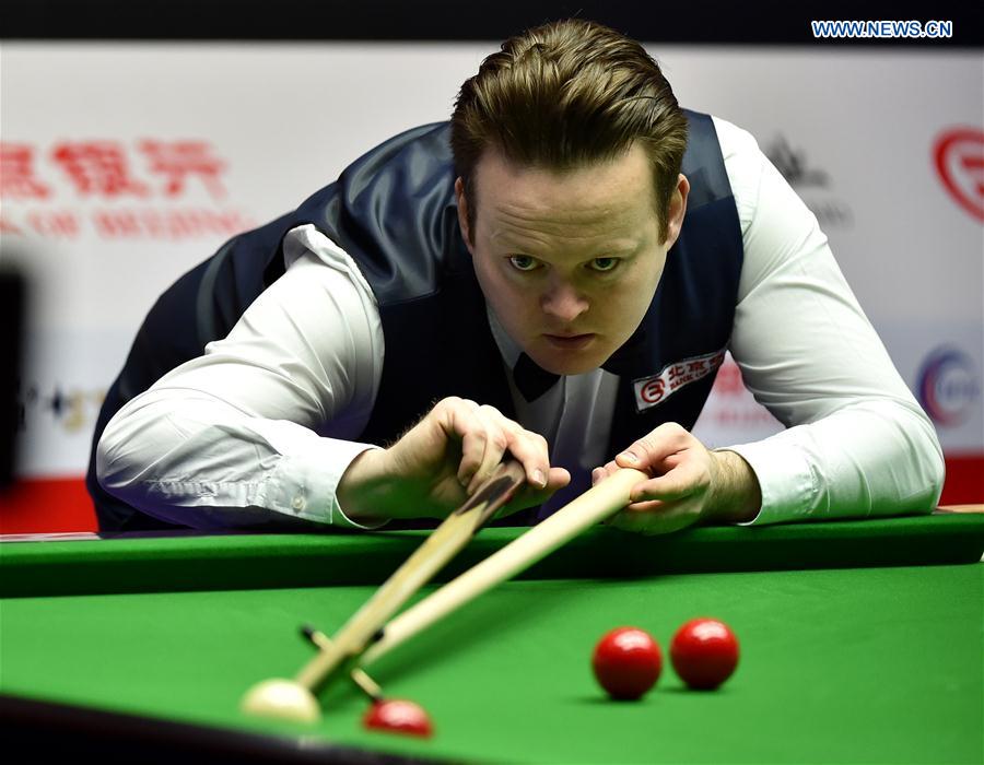 Shaun Murphy of England competes during the first round of 2017 World Snooker China Open Tournament against his compatriot Allen Taylor, in Beijing, capital of China, March 27, 2017. 