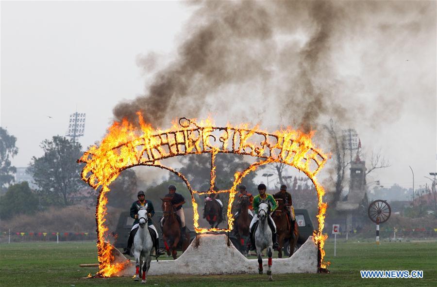 Horses jump through fire rings during the Ghode Jatra, a horse racing festival at Army Pavilion, Tundikhel in Kathmandu, Nepal, March 27, 2017. (Xinhua/Sunil Sharma) 