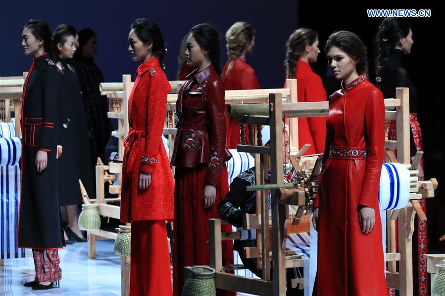 Models present creations at the EVE CINA collection show during the China Fashion Week in Beijing, capital of China, March 27, 2017. 