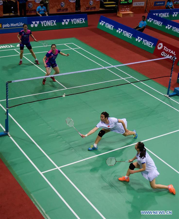 Huang Yaqiong (2nd R) and Tang Jinhua (1st R) of China compete during the first round of women's double against Chang Ye Na and Lee So Hee of South Korea in Yonex Sunrise Indian Open Badminton Championship in New Delhi, India, March 29, 2017. Huang Yaqiong and Tang Jinhua won 2-0.