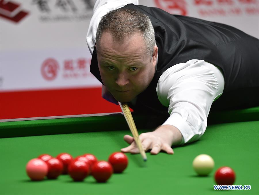 John Higgins of Scotland competes during the second round match of 2017 World Snooker China Open Tournament against Mark Davis of England in Beijing, capital of China, March 29, 2017. John Higgins won 5-2.