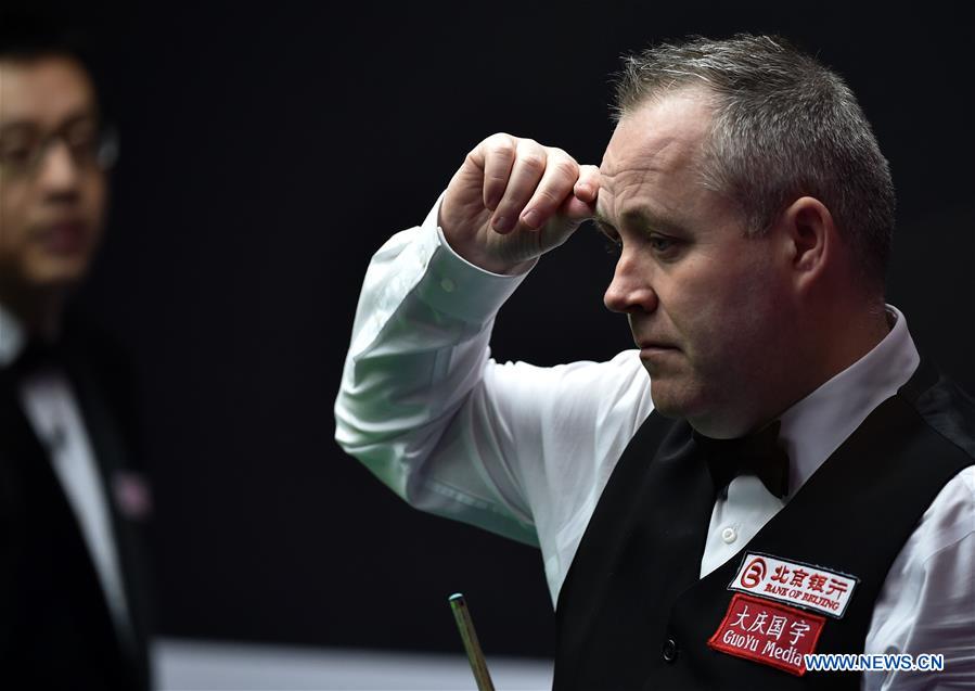 John Higgins of Scotland reacts during the second round match of 2017 World Snooker China Open Tournament against Mark Davis of England in Beijing, capital of China, March 29, 2017. John Higgins won 5-2.
