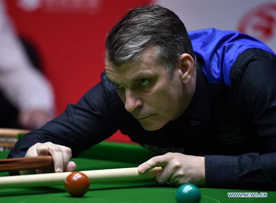 Mark Davis of England competes during the second round match of 2017 World Snooker China Open Tournament against John Higgins of Scotland in Beijing, capital of China, March 29, 2017. Mark Davis lost 2-5.