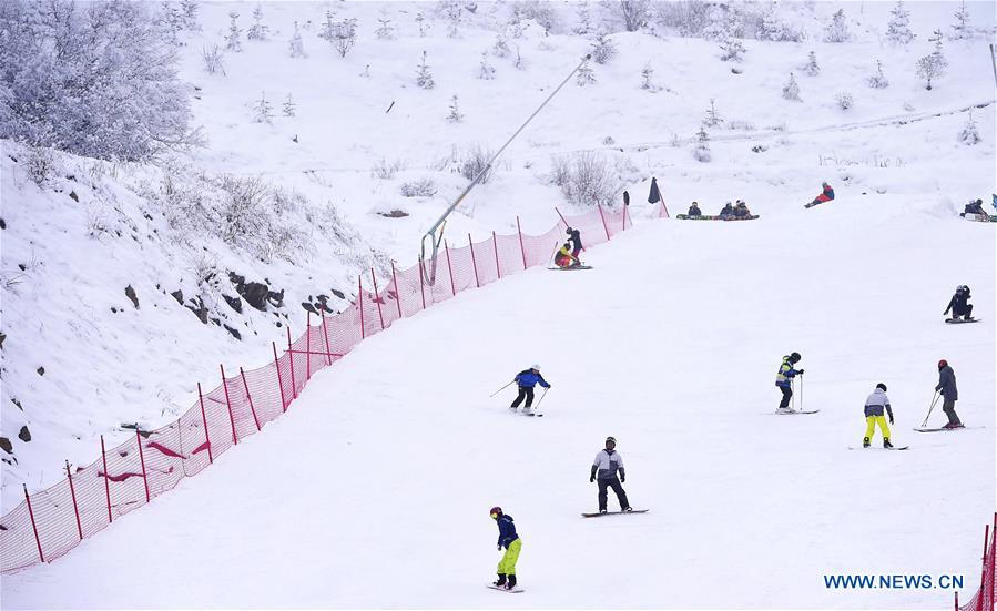People ski in Taiziling Ski Resort located on the Jiuding Montain in Aba, southwest China's Sichuan Province, Feb. 26, 2017.