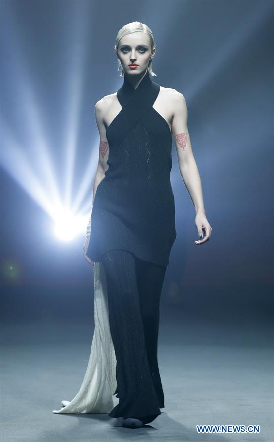 A model presents a creation designed by Carey Xu during China Fashion Week in Beijing, capital of China, March 29, 2017. (Xinhua/Li Mingfang) 