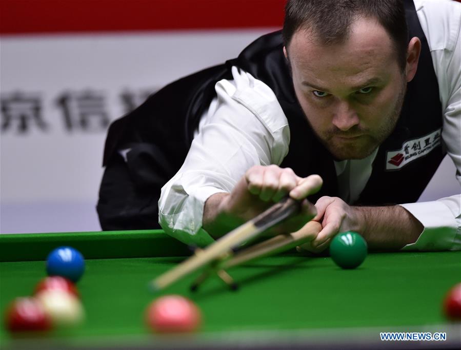 Mark Joyce of England competes during the second round match of 2017 World Snooker China Open Tournament against his compatriot Ronnie O'Sullivan in Beijing, capital of China, March 29, 2017. Mark Joyce won by 5-4. (Xinhua/Zhang Chenlin) 