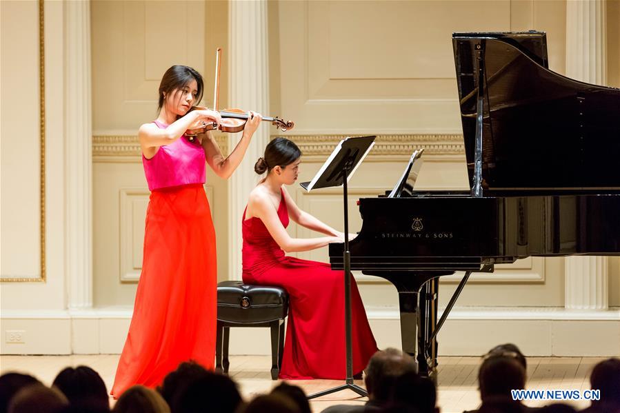 Chinese violinist Wang Jiazhi performs during her Carnegie Hall debut in New York, the United States, March 28, 2017. As a prize-winner of the Washington International Competition and China Young Artist Competition, Wang Jiazhi has appeared at music festivals around the world as soloist, recitalist and chamber musician. (Xinhua/Tang Siyu) 