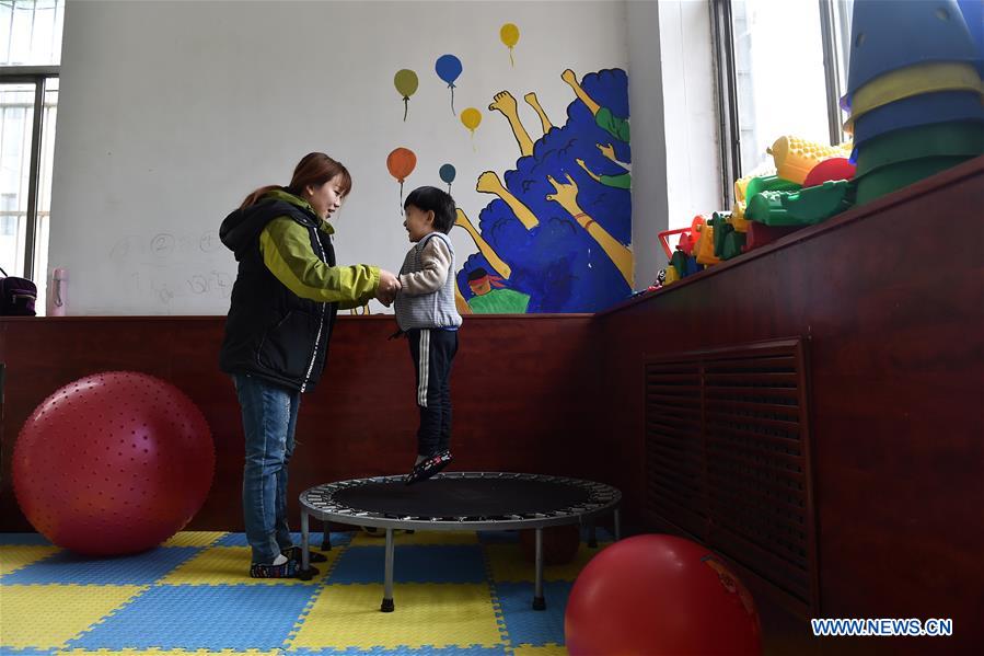 A child is pictured during a training course at a service center of the Lingxing community in Taiyuan, capital of north China's Shanxi Province, March 28, 2017. Established in 2010, the service center has accommodated over 60 children with autism. A total of 29 teachers take part in the rehabilitation program to help these children. April 2 marks the World Autism Awareness Day. (Xinhua/Zhan Yan) 