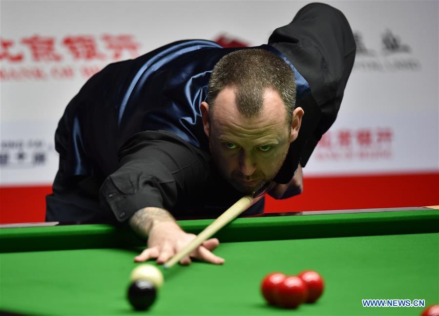 Mark Williams of Wales competes during the 3rd round match against John Higgins of Scotland at the 2017 World Snooker China Open Tournament in Beijing, capital of China, March 30, 2017. Mark Williams won 5-4.