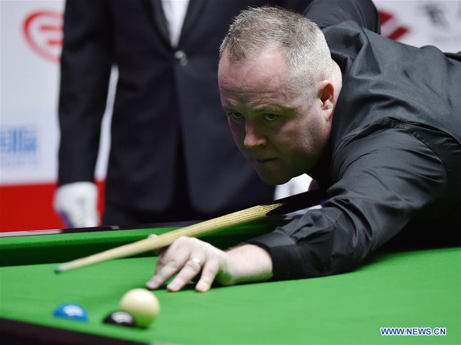 John Higgins of Scotland competes during the 3rd round match against Mark Williams of Wales at the 2017 World Snooker China Open Tournament in Beijing, capital of China, March 30, 2017. Mark Williams won 5-4.