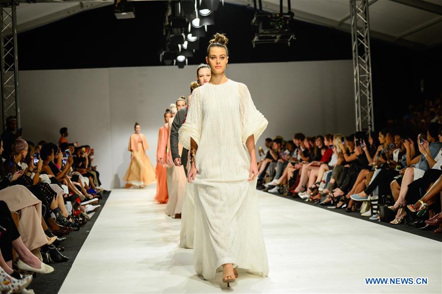 Models present creations by designer Chu Yan during South African Fashion Week Spring Summer 2017 at Hyde Park Corner in Johannesburg, South Africa, on March 30, 2017. The South African Fashion Week Spring Summer 2017 kicked off here Tuesday. Creations by more than 60 South African and international fashion designers or brands are scheduled to be presented in the five-day event. (Xinhua/Zhai Jianlan) 