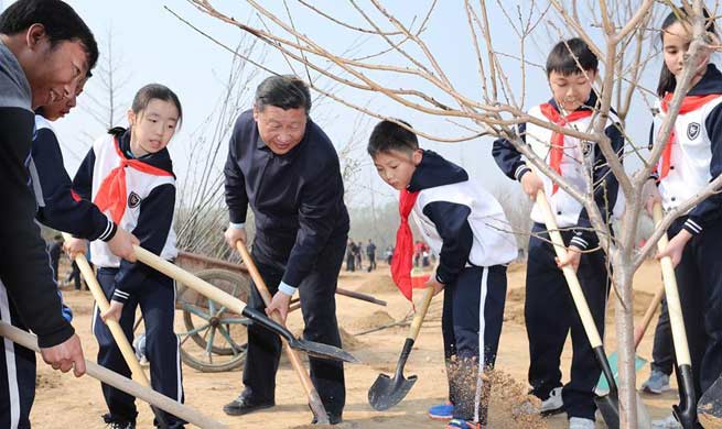 Xi attends tree planting activity, calls for understanding, protecting 
nature