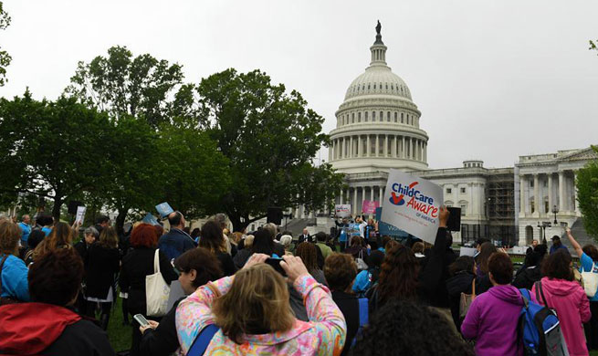 People attend rally raising awareness of child care in Washington