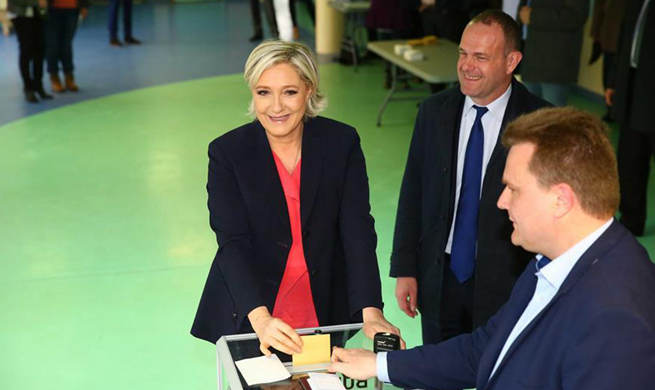Macron, Le Pen cast votes in French presidential runoff