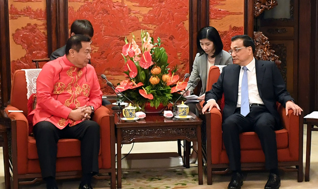 China, Philippines agree to further improve bilateral ties