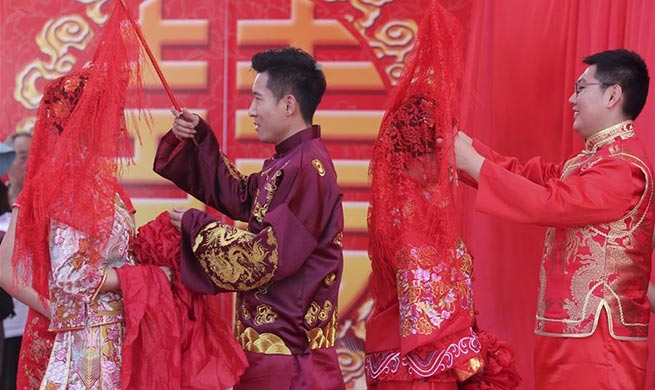 Look of love: Many Chinese couples get married on May 20