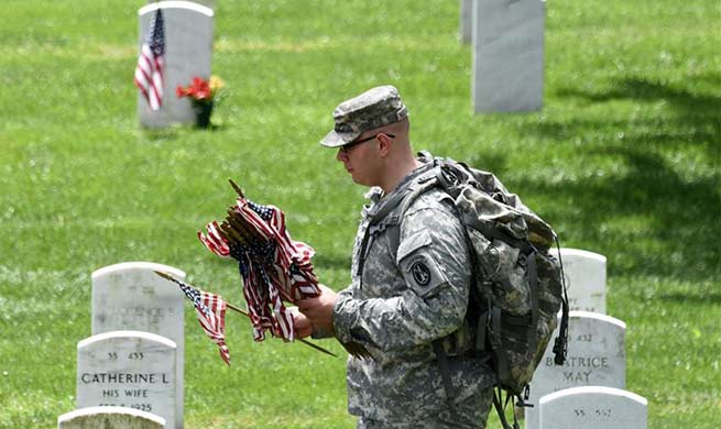 "Flags-In" ceremony held at Arlington National Cemetery in U.S.