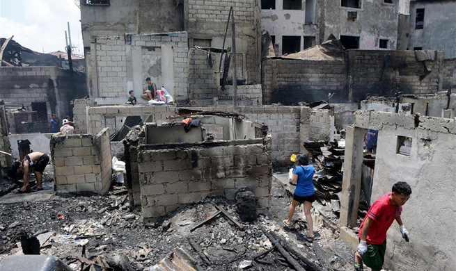 Over 100 shanties razed after fire in Manila