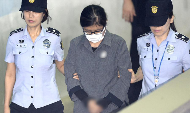 S. Korean ex-president's confidante gets 3-year prison term over corruption scandal