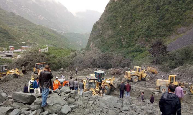Over 100 buried in southwest China landslide