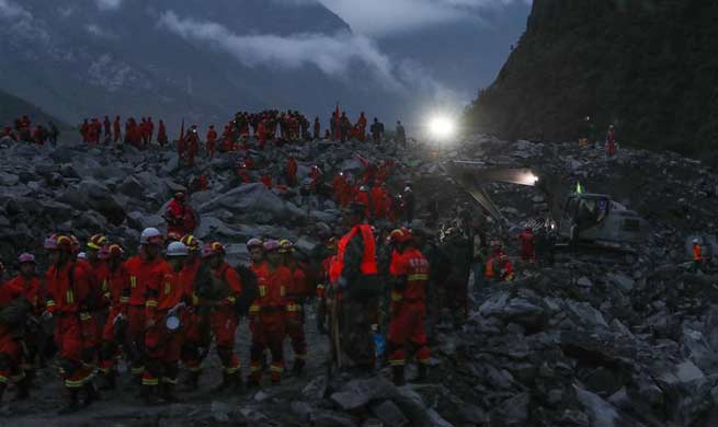 15 found dead in SW China landslide burying 120