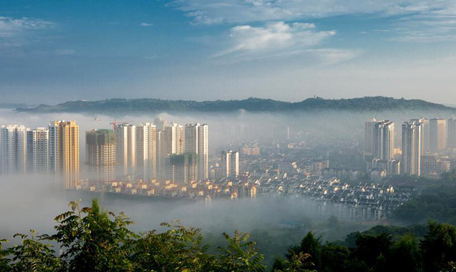 Buildings shrouded by advection clouds in Chongqing, SW China