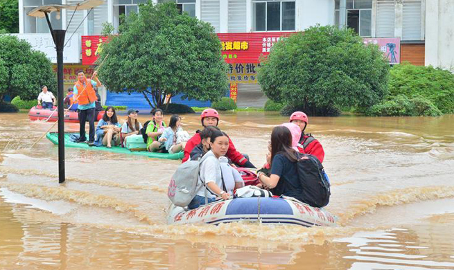 16 dead, 94,000 relocated after flood hits south China