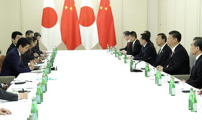Xi, Abe meet on ties, reaffirm readiness to strengthen China-Japan partnership