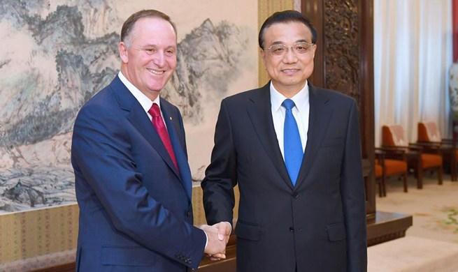 Premier Li says China to open wider to world