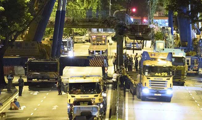 Trailer crashes on pedestrian bridge in Singapore, causing no casualties
