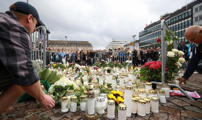 People commemorate victims of knife attack in Finland