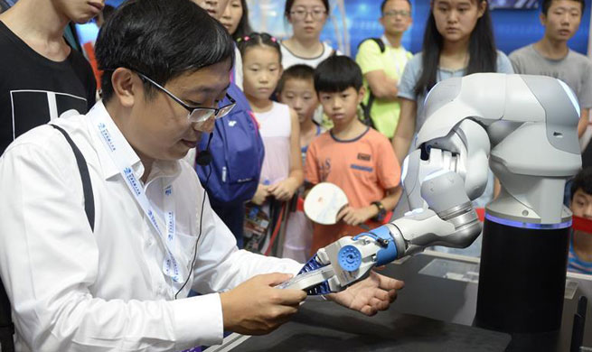 People experience technology of robot in World Robot Conference