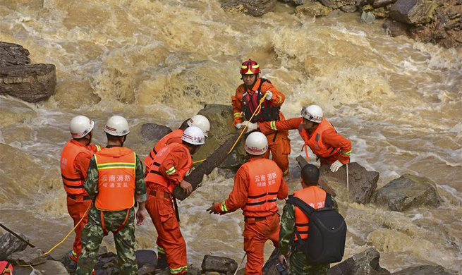 Rescuers check landslide sites in SW China's county