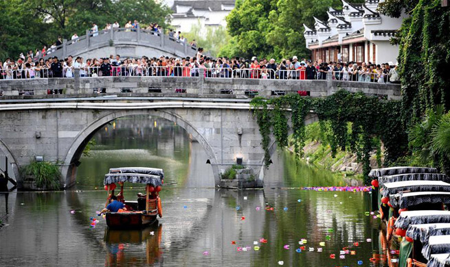 E China holds river lantern festival to greet upcoming Qixi festival