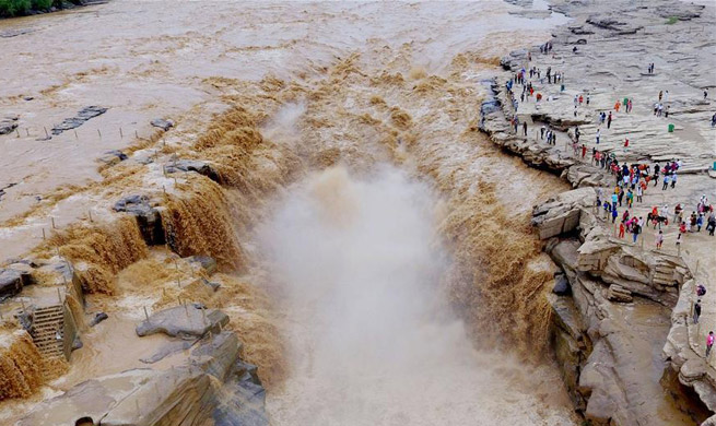 Water volume of Hukou Waterfall surges due to heavy rainfall