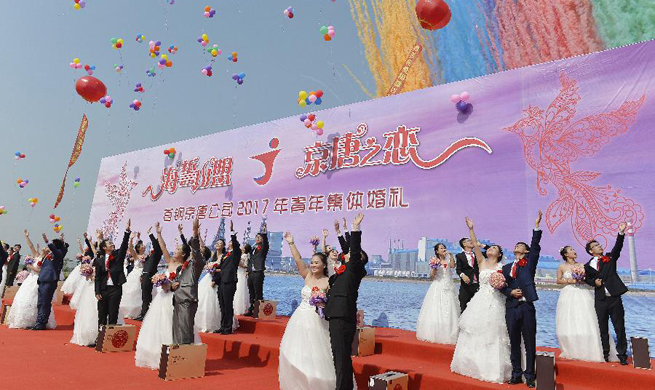 21 pairs of newlyweds attend group wedding ceremony in N China's Hebei