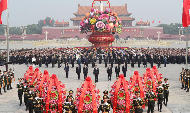China's Xi pays tribute to national heroes at Tian'anmen Square