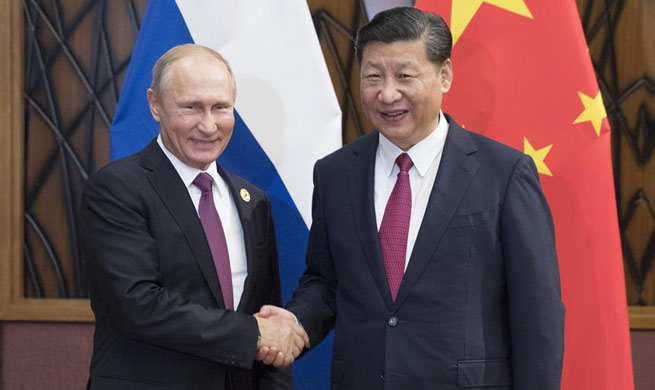 Xi, Putin pledge to enhance regional, int'l cooperation