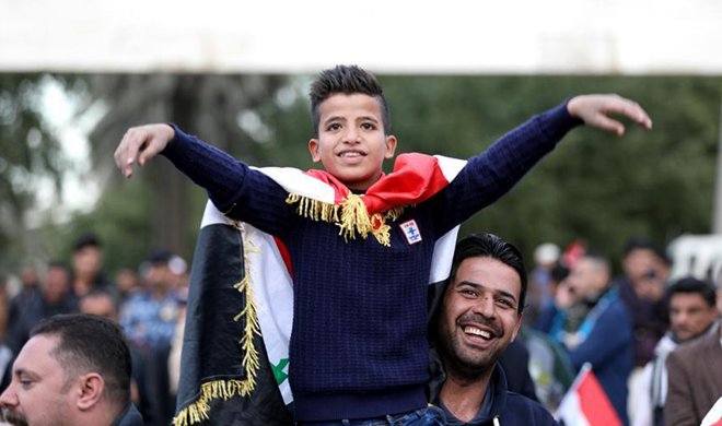 People celebrate full liberation of Iraq from IS in Baghdad