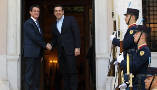 Greek PM welcomes French counterpart in Athens