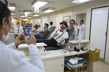 Man dressed as clown marks World Blood Donor Day in Brazil
